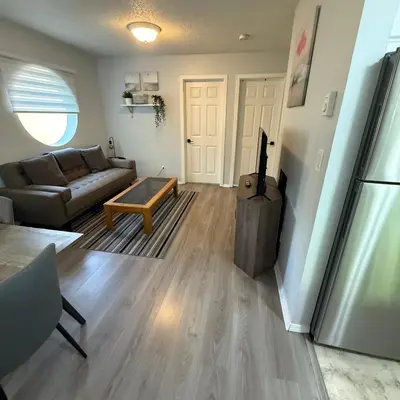 a living room with a couch and a table at Lovely 2 bedroom condo, 2 minute walk fr downtown in Invermere