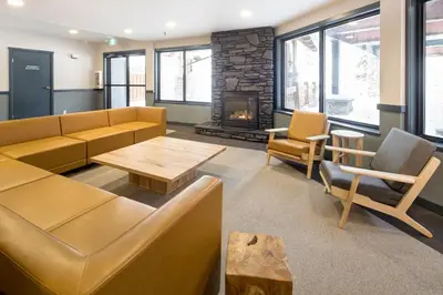 a living room with a couch and a fireplace at The Approach Hotel in Panorama