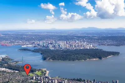 an aerial view of a city with a red marker at Great West Vancouver house with hot tub, across from beach & 10 mn to Downtown Vancouver in West Vancouver