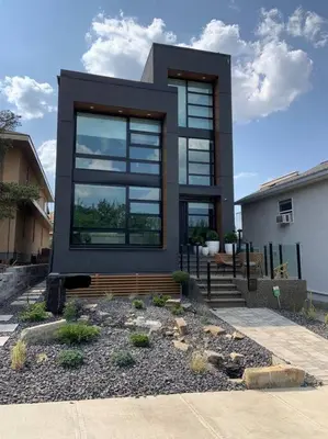 a house with a large window on the side of it at Executive Bsmt Suite, King Bed, 5 min to DT & Whyte Ave, Sleeps 6! in Edmonton