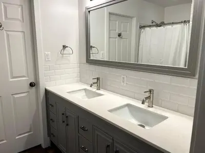 a bathroom with two sinks and a mirror at Escape to Spring Gate Estate in Victoria