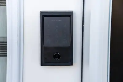 a remote control is attached to a door at Modern Nordic Escape, 3BR Near WEM & DT, AirCon & Fireplace, Wifi, Sleeps 6! in Edmonton