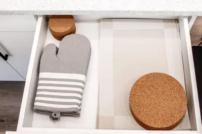a drawer filled with towels and cork cushions at Modern Nordic Escape, 3BR Near WEM & DT, AirCon & Fireplace, Wifi, Sleeps 6! in Edmonton