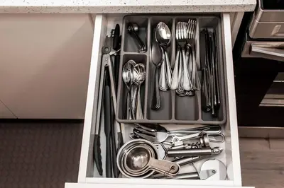 a drawer filled with utensils in a kitchen at Cozy Nordic Utopia, Bsmt Suite near WEM & DT, King Bed, WiFi in Edmonton