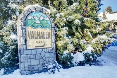a sign for a villille sign in the snow at Whistler Steps to Village Sleeps 8 + Jacuz + Park in Whistler