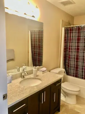 a bathroom with a sink and a toilet at Luxury 3700 sq/ 5 bedroom/ jettedtub/ 4 fireplaces in Edmonton