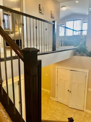 a staircase in a house with a cat sitting in a room at Luxury 3700 sq/ 5 bedroom/ jettedtub/ 4 fireplaces in Edmonton