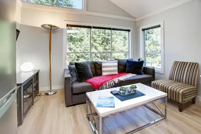 a living room with a couch and a table at Gondola Haus - Free parking in Whistler