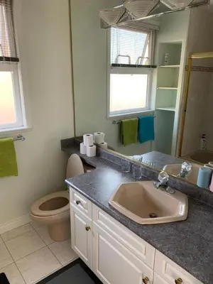 a bathroom with a sink and a toilet at Xin Xin House in Richmond