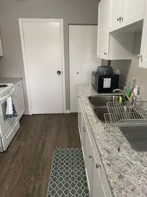 a kitchen with a sink and a counter top at Wonderful 2-bedroom apartment in Camrose
