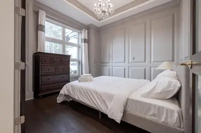 a white bedroom with a bed and a window at Luxurious Private Rooms in Richmond in Richmond
