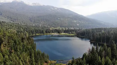 a large lake in the middle of a mountain at 260 The Aspens - Ski In Ski Out in Whistler