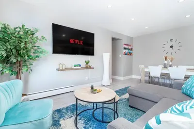 a living room with a couch and a table at Modern & Stylish 2-Bedroom Unit in Edmonton
