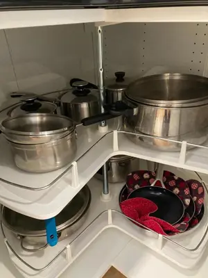 a kitchen with pots and pans in a refrigerator at Bright poolside walkout two bedroom basement suite in the Okanagan in Penticton