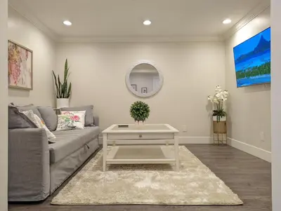 a living room with a couch and a table at Nice home away at Vancouver near YVR in Vancouver