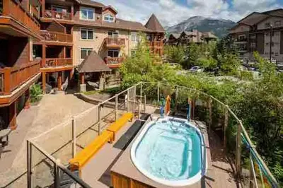 a swimming pool on the balcony of a house at Falcon Crest Lodge 1 BR Condo With Gym & Hot-Tubs & Mountain View in Canmore