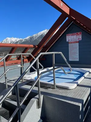 a deck with awning and stairs on a building at Wanna get away next Summer and Fall at the Crossing in Canmore
