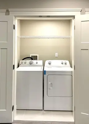 a kitchen with a stove and a dishwasher at New two-bedroom legal suite with parking in White Rock