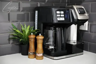 a coffee maker sitting on top of a counter at King Bed,Disney,Long Stays,Garage,Airport in Edmonton