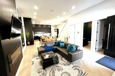 a living room with a couch and a table at Stunning 3BR Luxury Home N/Edm*2 king beds* in Edmonton