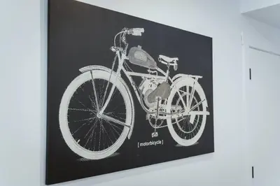 a drawing of a bicycle on a wall at NYC Loft Inspired •12 mins to WEM •Vintage arcade in Edmonton