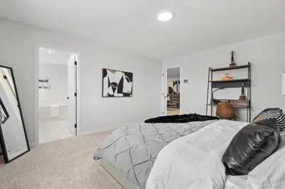 a white bedroom with a bed and a mirror at Luxury-4bed with AC-86