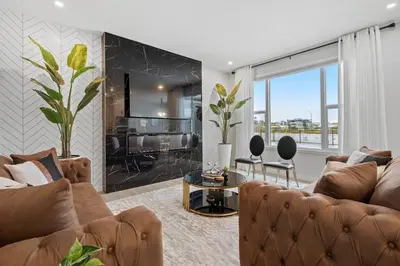 a living room with a couch and a table at Luxury-4bed with AC-86