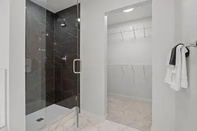 a shower with a glass door in a bathroom at Luxury-4bed with AC-86