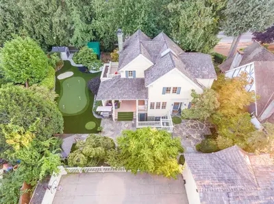 an aerial view of a house with a golf course at Vancouver Golf Villa - Private Oasis in Vancouver