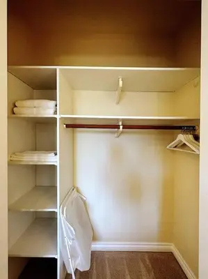 an empty closet with white shelves in a room at Super Cosy 8Bed & 6Bath in Vancouver heart near to airport and DownTown in Vancouver