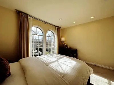 a bedroom with a large bed and a window at Super Cosy 8Bed & 6Bath in Vancouver heart near to airport and DownTown in Vancouver