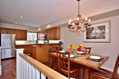 a kitchen and dining room with a table and chairs at Villas at Eldorado Resort in Kelowna