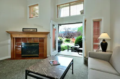a living room with a couch and a fireplace at Villas at Eldorado Resort in Kelowna