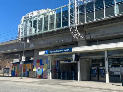 a building with a building with a bridge above it at Cozy 2 beds Spacious rooms,Close to transit in Vancouver
