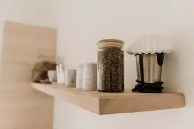 a shelf with a jar filled with coffee beans at Drift West Coast Getaway in Ucluelet