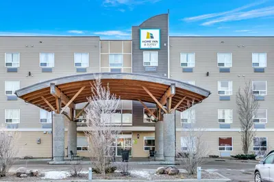 a large building with awning in front of it at Home Inn and Suites Lloydminster in Lloydminster