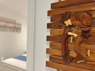 a wooden horse decoration on the side of a wall at Fancy Family Suite with Parking near UBC in Vancouver