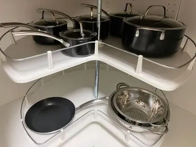 a white shelf with pots and pans on it at Cozy Furnished Apartment in Simpson