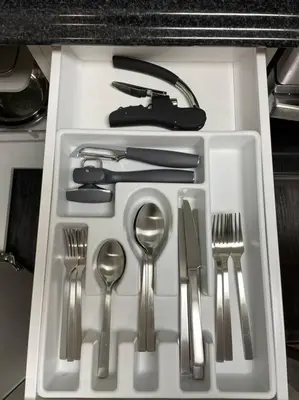 a white tray with silver utensils in a drawer at Cozy Furnished Apartment in Simpson