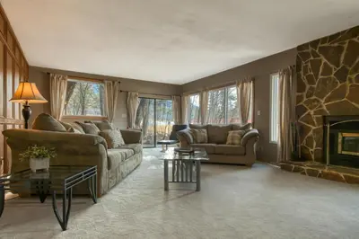 a living room with a couch and a fireplace at Fairmont Hot Springs, 3 Bedroom Vacation Home in Fairmont Hot Springs