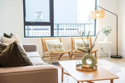 a living room with a couch and chairs and a table at Adanac by Revelstoke Vacations in Revelstoke