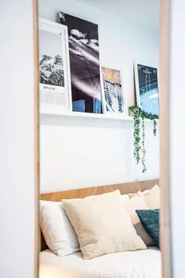 a white couch in a room with pictures on the wall at Adanac by Revelstoke Vacations in Revelstoke