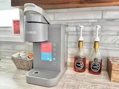 a coffee maker and two bottles of ketchup at The Beach House at Deep Bay in Bowser
