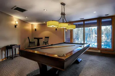 a billiard room with a pool table in it at 3 Bedroom Condo by Canadian Rockies Vacation Rentals in Canmore