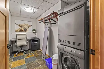 an office with a washer and dryer in a room at 3 Bedroom Condo by Canadian Rockies Vacation Rentals in Canmore