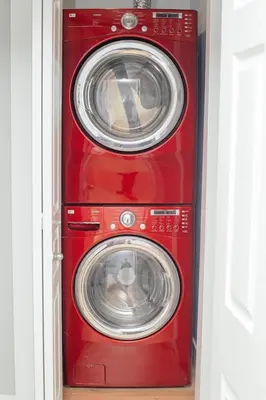 a red washer and dryer in a room at Cozy 3 Bedroom Contemporary Home With Free Parking in Edmonton