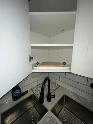 a small kitchen with a sink and a counter at Brand new 1 Bedroom Basement Suite. Wi-Fi,Netflix in Edmonton