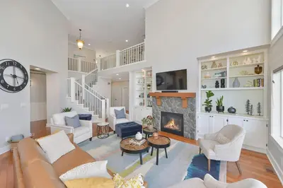 a living room with a couch and a fireplace at Mount Finlayson View Villa by EMR Vacation Rentals in Victoria