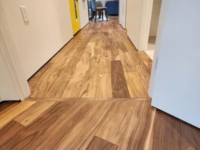 a hallway with wooden flooring in an apartment at The Shed at Moon Dance in Madeira Park