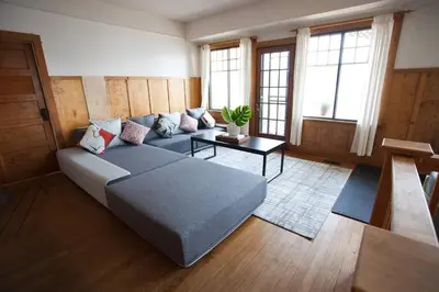 a living room with a bed and a table at Iconic 3-Story Waterfront 'Marina House' w/ View in Gibsons